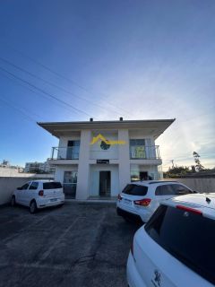 Apto dois dormitórios com suíte, sacada e churrasqueira.