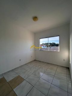 Apto dois dormitórios com suíte, sacada e churrasqueira.