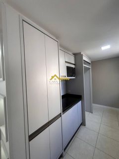 Apto dois dormitórios, móveis planejados cozinha e vaga livre de garagem
