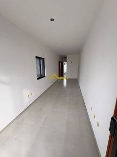 Casa em Palhoça com churrasqueira a carvão .