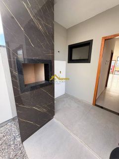 Casa em Palhoça com churrasqueira a carvão .