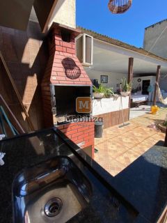 Casa no bairro Aponiã com piscina e terreno de 250m²