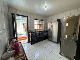 Casa com 5 dormitórios sendo 1 suíte e piscina no bairro Aponiã 180m²