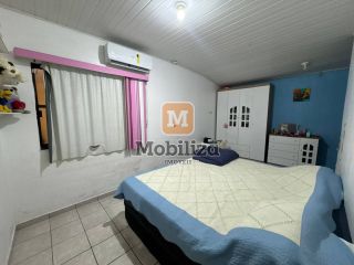 Casa com 5 dormitórios sendo 1 suíte e piscina no bairro Aponiã 180m²