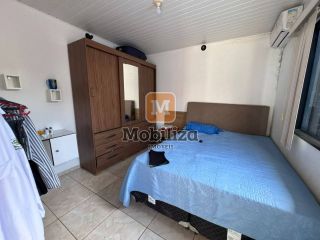 Casa com 5 dormitórios sendo 1 suíte e piscina no bairro Aponiã 180m²