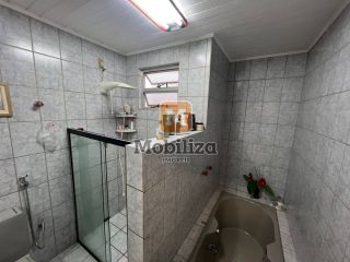 Sobrado com 3 dormitórios e uma ampla área externa com piscina e ambiente arborizado - bairro Rio Madeira