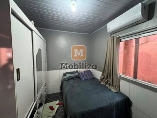 Casa com 3 quartos sendo 1 suíte, quintal amplo e ótima localização no bairro Aponiã