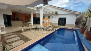 Casa com 4 suítes, ambientes espaçosos, área gourmet e piscina no Condomínio Bougainville