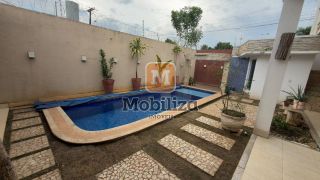 Casa com 4 suítes, ambientes espaçosos, área gourmet e piscina no Condomínio Bougainville