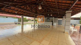 Casa com 4 suítes, ambientes espaçosos, área gourmet e piscina no Condomínio Bougainville