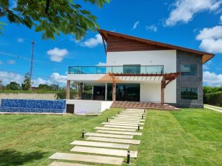 Casa espetacular no condomínio Raízes da Serra II,500M,5 suítes, espaço gourmet, piscina privativa