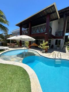 Casa em condomínio fechado em Muro Alto, 485m², 4 suítes, varanda, lavabo, cozinha integrada, piscina, 4 vagas de garagem