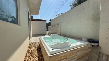 Casa na praia com jacuzzi sendo vendida abaixo do valor de mercado