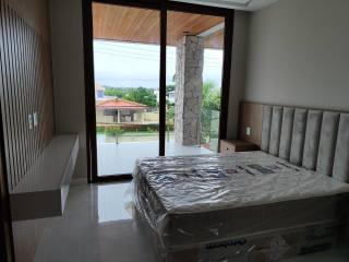 Casa de Condomínio Para Vender com 6/4 sendo 6 suítes em Guarajuba, Camaçari