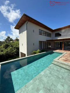 Casa Alto Padrão à Venda no Condomínio Praia Bella, Localização privilegiada: lote com frente, fundo e lateral direita para alameda.