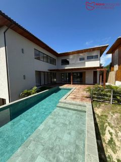 Casa Alto Padrão à Venda no Condomínio Praia Bella, Localização privilegiada: lote com frente, fundo e lateral direita para alameda.