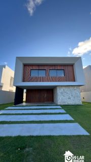 Casa Exclusiva com 4 Suítes e Área Gourmet à Venda no Alphaville Litoral Norte 2