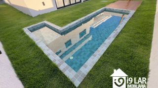 Casa Exclusiva com 4 Suítes e Área Gourmet à Venda no Alphaville Litoral Norte 2