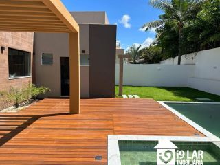 Casa moderna 4 suítes no Alphaville Litoral Norte 1, 280m², pé-direito duplo e área gourmet integrada