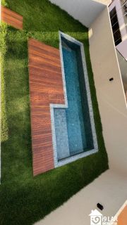 Casa 4 suítes no Alphaville Litoral Norte 2, 294m², pé-direito duplo, piscina e arquitetura moderna