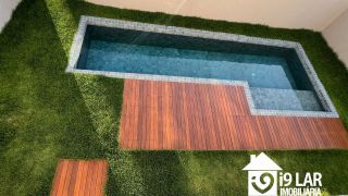Casa 4 suítes no Alphaville Litoral Norte 2, 294m², pé-direito duplo, piscina e arquitetura moderna
