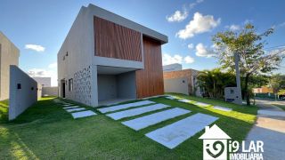 Casa 4 suítes no Alphaville Litoral Norte 2, 294m², pé-direito duplo, piscina e arquitetura moderna