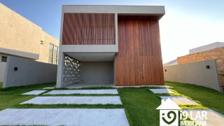 Casa 4 suítes no Alphaville Litoral Norte 2, 294m², pé-direito duplo, piscina e arquitetura moderna