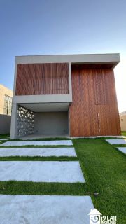 Casa 4 suítes no Alphaville Litoral Norte 2, 294m², pé-direito duplo, piscina e arquitetura moderna