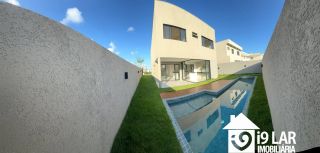 Casa 4 suítes no Alphaville Litoral Norte 2, 294m², pé-direito duplo, piscina e arquitetura moderna