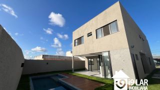 Casa 4 suítes no Alphaville Litoral Norte 2, 294m², pé-direito duplo, piscina e arquitetura moderna