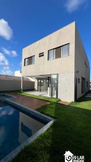 Casa 4 suítes no Alphaville Litoral Norte 2, 294m², pé-direito duplo, piscina e arquitetura moderna