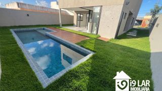 Casa 4 suítes no Alphaville Litoral Norte 2, 294m², pé-direito duplo, piscina e arquitetura moderna