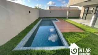 Casa 4 suítes no Alphaville Litoral Norte 2, 294m², pé-direito duplo, piscina e arquitetura moderna