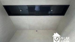 Casa 4 suítes no Alphaville Litoral Norte 2, 294m², pé-direito duplo, piscina e arquitetura moderna