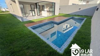 Casa 4 suítes no Alphaville Litoral Norte 2, 294m², pé-direito duplo, piscina e arquitetura moderna