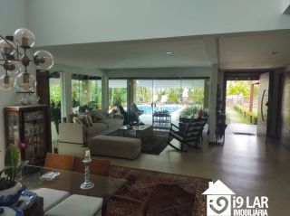 Casa 6 suítes em Busca Vida, 480m², terreno de 1.000m², energia solar e acesso à praia