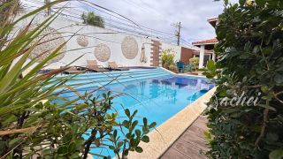 Casa de alto padrão com 4 suítes, piscina privativa e aproximadamente 500 m² de área construída
