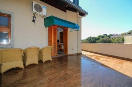 Venda casa em condomínio com 609m², 6 dormitórios, 4 vagas, Bairro Cavalhada, Porto Alegre.
