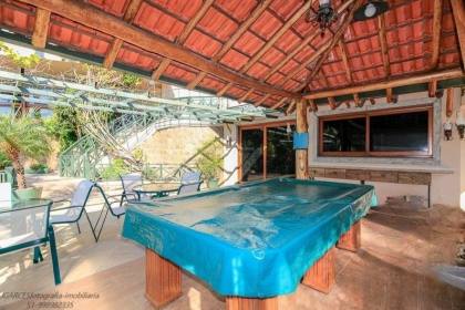 Venda casa em condomínio com 609m², 6 dormitórios, 4 vagas, Bairro Cavalhada, Porto Alegre.