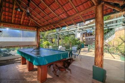 Venda casa em condomínio com 609m², 6 dormitórios, 4 vagas, Bairro Cavalhada, Porto Alegre.