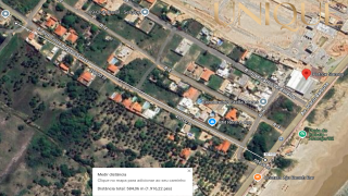 Lote a 500m da praia em rua pública - no Robalo