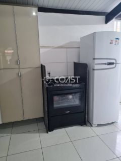 Vendo Excelente Casa com 3/4 em condomínio fechado em frente a praia