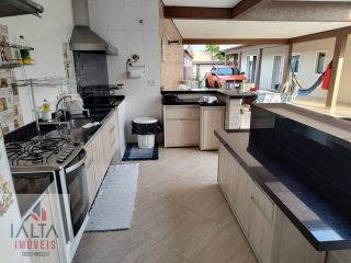 Casa 4 dorm. sendo 3 suites energia solar, piscina, hidromassagem, sauna, fino acabamento