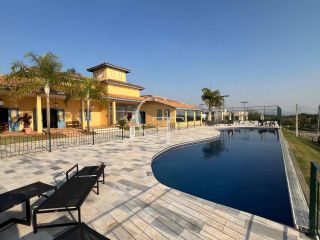 Casa à Venda no Fazenda Kurumin | 4 Suítes, Vista Livre e Piscina com Borda Infinita