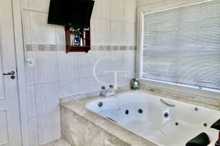 Casa à venda no Condomínio Plaza Athénée com suíte master no térreo, piscina com spa, academia e área gourmet completa | Alto padrão em Itu