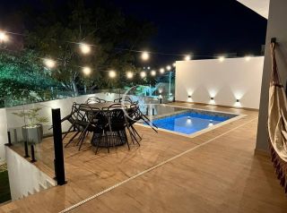 Casa Térrea à Venda no Condomínio Gardenville em Itu | 3 Suítes, Piscina Aquecida e Vista Permanente para Área Verde