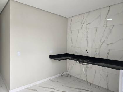 Casa térrea  com 2 vagas de garagens e quintal com área  gourmet