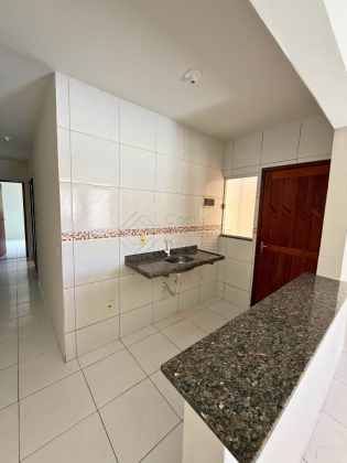 Casa com suíte e terreno gigante no Santos Dumont, próximo de tudo.