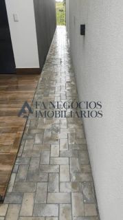 Alugo casa em condomínio fechado com 03 suítes