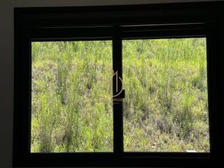 Sobrado geminado em condomínio fechado no Jardim Sofia